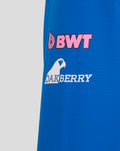 Close up of blue BWT Alpine rain jacket showing pink BWT logo and Oakberry branding on the sleeve area