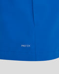 Blue rain jacket fabric close up with PROTEK marking near the hem