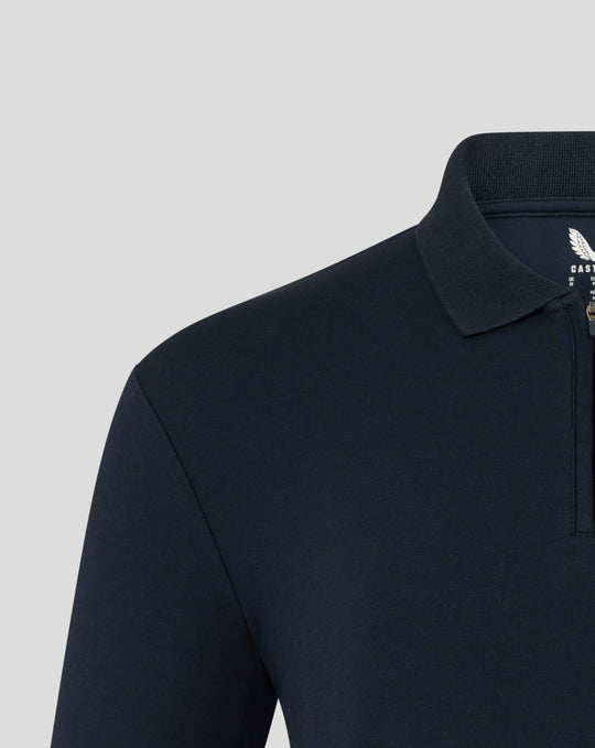 Navy Formula One Team Travel Collection polo with rib collar and concealed silver zip left chest Alpine A Castore branding.