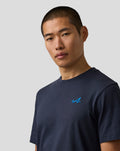 Male model wearing navy Night Sky core T shirt with blue embroidered A on left chest