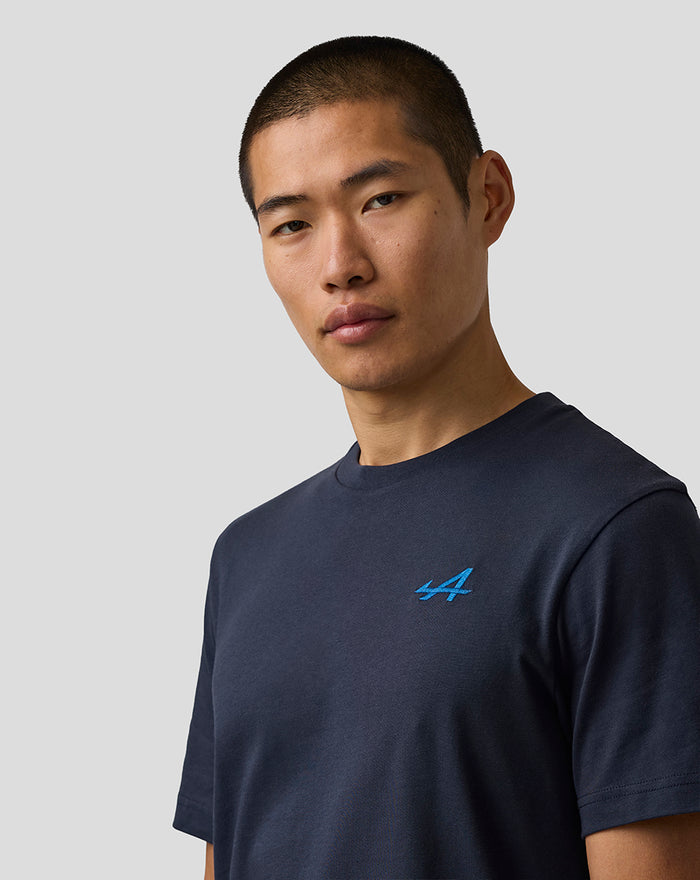 Male model wearing navy Night Sky core T shirt with blue embroidered A on left chest