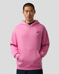 Front view of model wearing pink wild orchid Unisex Core Hoodie with blue Alpine A on left chest and a kangaroo pocket