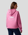 Female model wearing pink hoodie with large white BWT Alpine logo on the back.