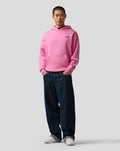 Male model wearing pink core hoodie with kangaroo pocket and small blue A logo on left chest.