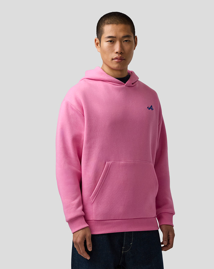 Female model wearing pink core hoodie with front kangaroo pocket and blue embroidered A on left chest.