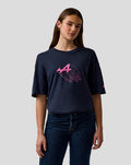 Female model in navy night sky relaxed fit graphic T shirt with pink Alpine A graphic on chest and sleeve