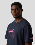 Male model in navy Night Sky T shirt with pink Alpine graphic on chest