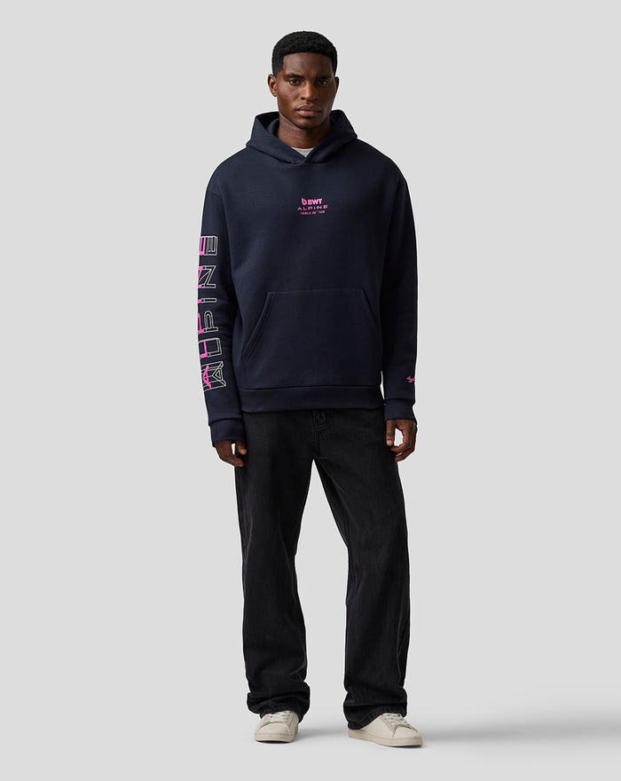 Man in navy Relaxed Fit Graphic Hoodie Night Sky front view with Alpine graphic on the left sleeve